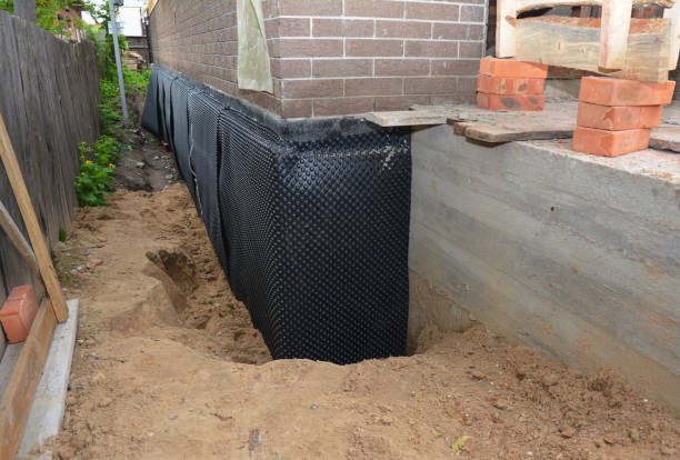 Happy homeowners after waterproofing job in Inkster